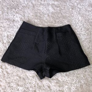 High waisted black shorts.